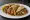 Taco al Vapor: an illustration of beans, potato, salsa, onion and more on tortilla.