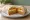 Taco Bell 7-Layer Burrito: an illustration of beans, rice, guacamole, sour cream and more on tortilla.