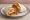 Taco Bell Burrito Supreme: an illustration of beef, beans, rice, cheese and more on tortilla.