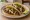 Taco de Alambre: an illustration of beef, bacon, onion, queso oaxaca and more on tortilla.