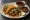 Taco de Birria de Chivo: an illustration of garlic, vinegar, oregano, cumin and more on tortilla.