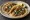 Taco de Cabeza: an illustration of onion, cilantro, lime and salsa on tortilla.