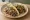 Taco de Cachete: an illustration of onion, cilantro, lime and salsa on tortilla.
