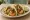 Taco de Camarón: an illustration of shrimp, garlic, onion, cilantro and more on tortilla.
