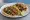 Taco de Carne Asada: an illustration of beef, onion, cilantro, lime and more on tortilla.