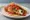 Taco de Chile Relleno: an illustration of cheese, egg, tomato and salsa on tortilla.