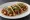Taco de Chorizo: an illustration of chorizo, potato, onion, cilantro and more on tortilla.