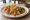Taco de Huevo con Chorizo: an illustration of egg, chorizo, onion, cilantro and more on tortilla.