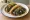 Taco de Huitlacoche: an illustration of corn, onion and salsa on tortilla.