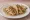 Taco de Jaiba: an illustration of crab, onion, cilantro, lime and more on tortilla.