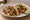 Taco de Lechón: an illustration of onion, cilantro, lime and salsa on tortilla.