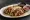 Taco de Poc Chuc: an illustration of pork, onion and cilantro on tortilla.