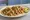 Taco de Pollo: an illustration of chicken, onion, cilantro, lime and more on tortilla.