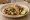 Taco de Pulpo: an illustration of octopus, onion, cilantro, lime and more on tortilla.