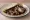Taco de Relleno Negro: an illustration of turkey, pork and onion on tortilla.