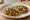 Taco de Tripas: an illustration of onion on tortilla.