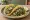 Taco de Verdolagas: an illustration of pork, salsa verde, onion and cilantro on tortilla.