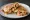 Taco Gobernador: an illustration of shrimp, cheese, onion and tomato on tortilla.