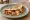 Taco Gobernador de Marlín: an illustration of cheese, onion and tomato on tortilla.