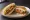 Taco Rice Sando (タコライスサンド): an illustration of beef, cheddar cheese, lettuce, tomato and more.