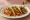 Taco Rojo: an illustration of chicken, tomato, onion and cilantro on tortilla.
