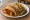 Taco Sudado: an illustration of pork, chorizo, potato and salsa verde on tortilla.