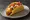 Taco Supreme: an illustration of beef, cheddar cheese, lettuce, tomato and more.