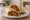 Tantuni Acılı: an illustration of beef, tomato, onion, parsley and more on pita.