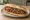 Tantuni Ekmek: an illustration of beef, tomato, onion, parsley and more on bread.