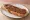 Tartine Nutella: an illustration of chocolate hazelnut spread and butter on baguette.