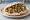 Tel Aviv Falafel Style: an illustration of falafel, hummus, tahini, parsley and more on pita.