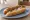 Texas Hot Weiner: an illustration of hot dog, mustard and onion on hot dog bun.