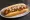 Texas Weiner: an illustration of hot dog, mustard and onion on hot dog bun.