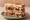 The Moistmaker: an illustration of turkey, stuffing, cranberry sauce and gravy on white bread.
