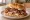 Three-Way Roast Beef: an illustration of beef, american cheese, mayonnaise and bbq sauce on kaiser roll.