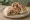Tikka Sandwich (ساندويش تكة): an illustration of beef, chicken, onion, parsley and more on pita.