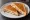 Toast: an illustration of ham, cheese and butter on white bread.