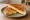 Toast Gvina (טוסט גבינה): an illustration of cheese and butter on white bread.