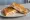 Toast Prosciutto e Formaggio: an illustration of prosciutto, mozzarella and butter on white bread.