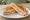 Toastbrot Sandwich: an illustration of ham, cheese and butter on bread.