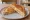 Toastie: an illustration of cheddar cheese, ham and butter on white bread.