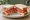 Tomato Sandwich: an illustration of tomato, mayonnaise and pepper on white bread.