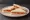Tomato Sandwich (Tea): an illustration of tomato, butter and pepper on white bread.