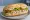 Ton Balıklı Sandviç: an illustration of tuna, mayonnaise, onion, lettuce and more on bread.