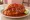 Torta Ahogada: an illustration of pork, pickled onion and lime.