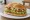 Torta de Aguacate: an illustration of avocado, refried beans, lettuce, tomato and more on bread.