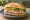 Torta de Atún: an illustration of tuna, mayonnaise, refried beans, avocado and more on bread.