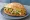 Torta de Flor de Calabaza: an illustration of onion, cheese and refried beans on bread.