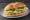 Torta de Huevo: an illustration of egg, refried beans, avocado, onion and more on bread.