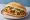 Torta de Huevo con Chorizo: an illustration of egg, chorizo, refried beans, avocado and more on bread.